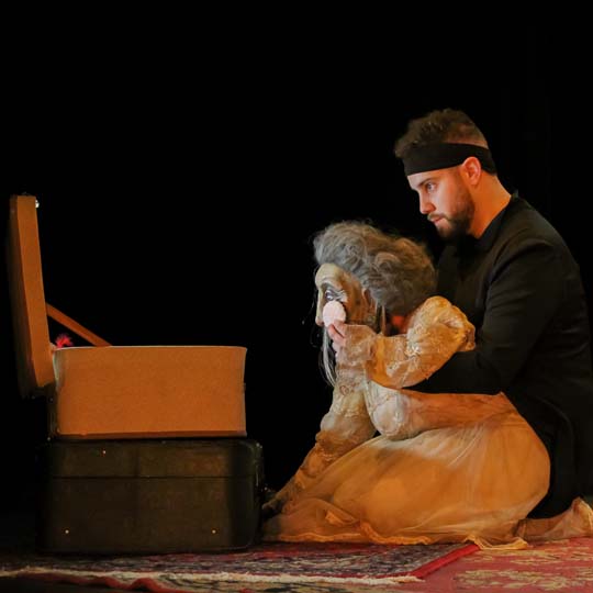 A man with a puppet