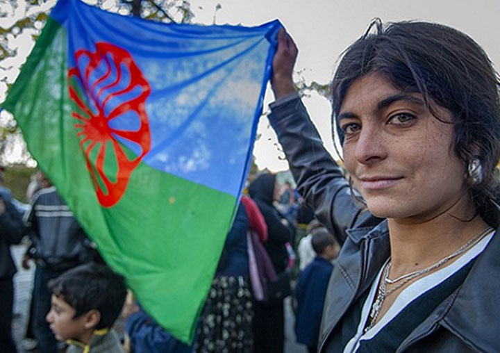 A woman with the Romani flag.