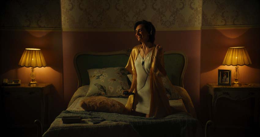 A woman sitting on a bed