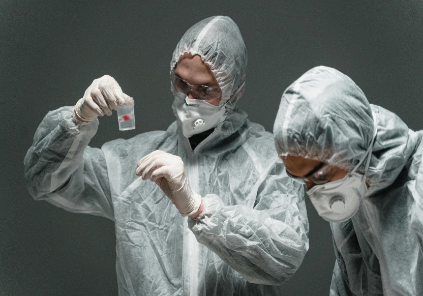 Two men working in safety suits