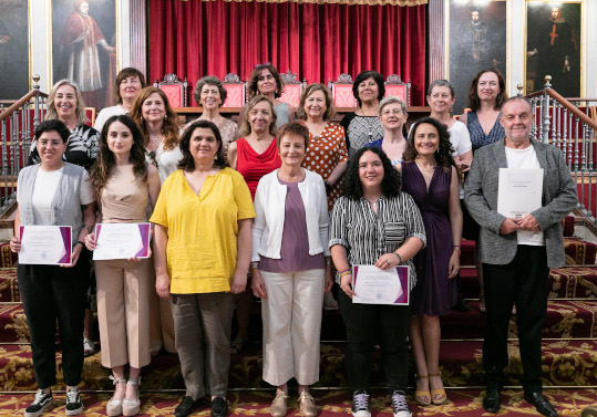 The principal and vice-principal with the award-winners and their supervisors