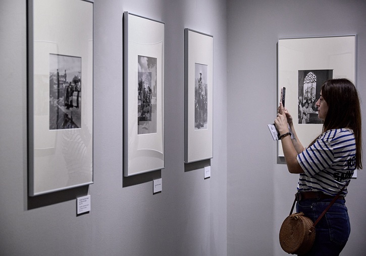 A woman looks at the exhibition.