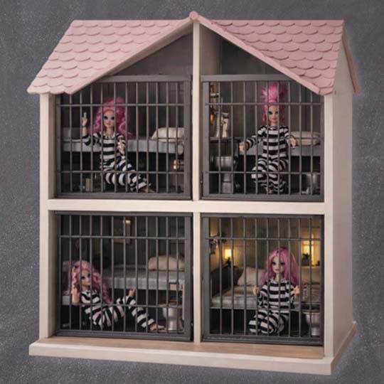 A dollhouse shaped like a prison with four dolls locked inside