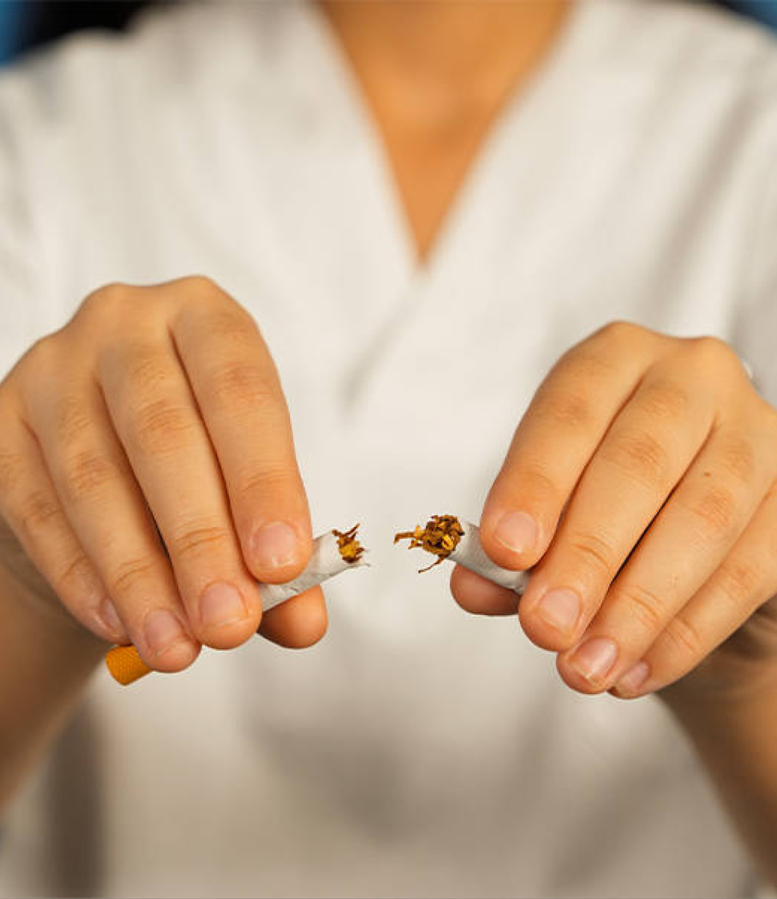 Woman breaking a cigarette