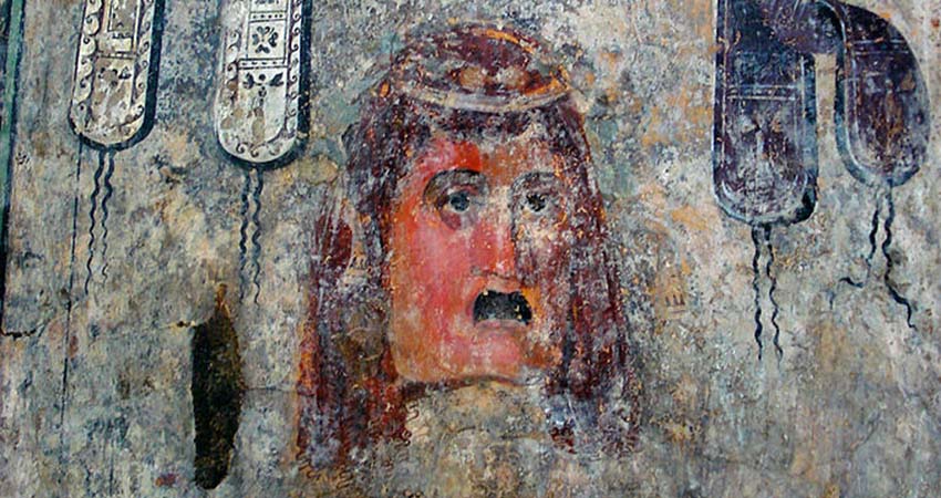 Drawing of a face on a wall
