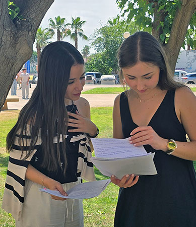 Students consulting documents