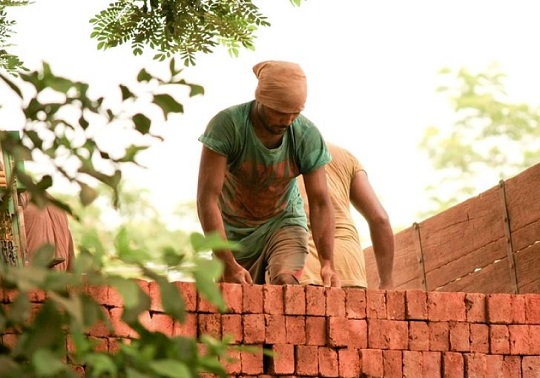 Worker working in bright sunlight