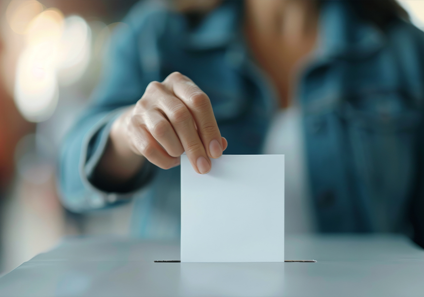 Placing a vote in the ballot box