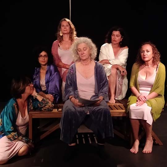 Six women on a stage