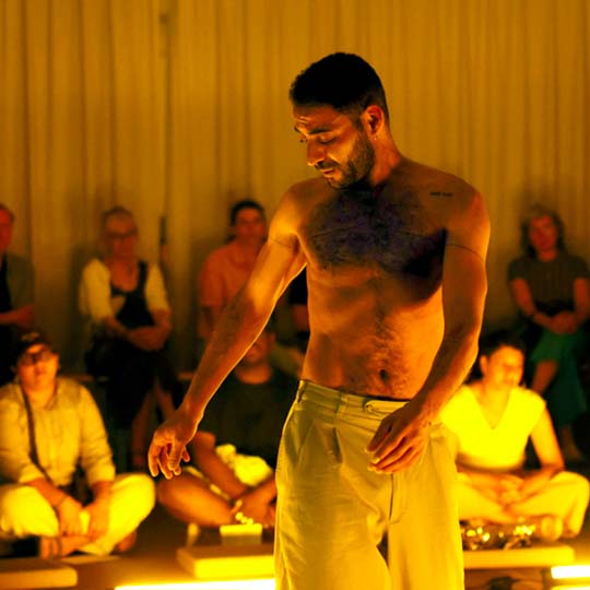 A man performing in front of an audience