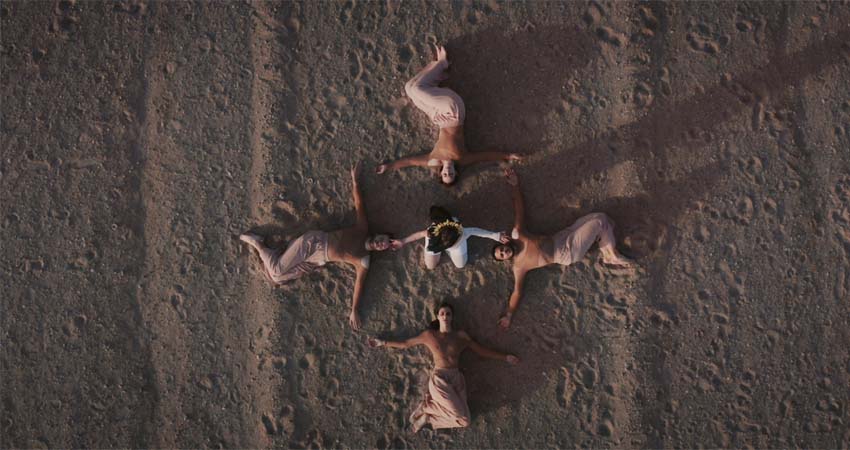 Five people lying on the ground