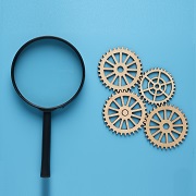 A magnifying glass and some mechanical bearings
