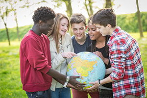 Group of young people with a world globe