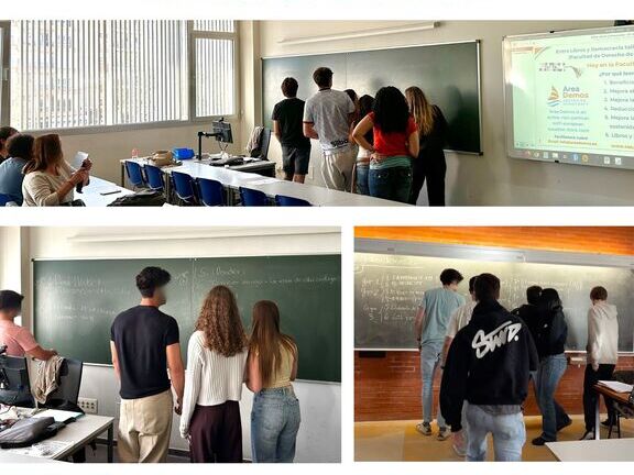 Participants writing on a blackboard during a classroom workshop - imatge 0