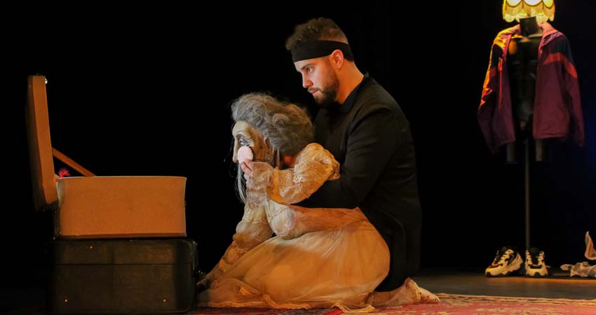 A man with a puppet