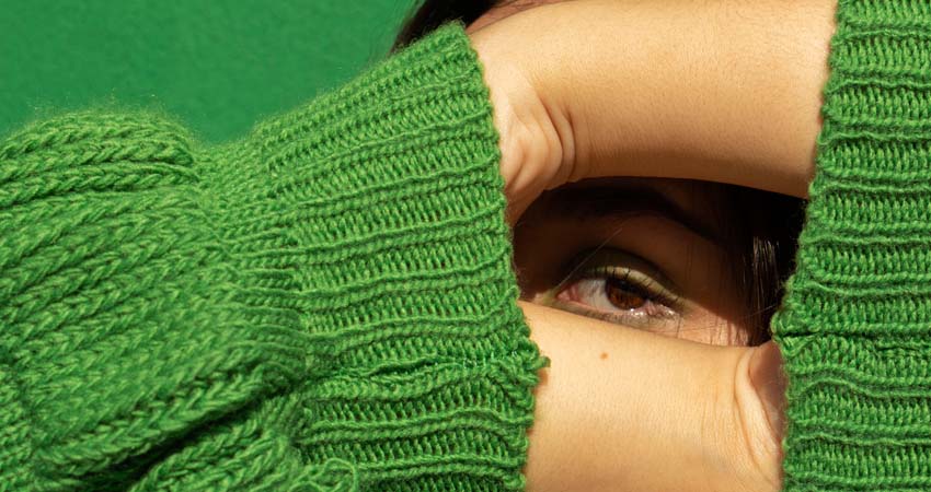 A girl covering her face