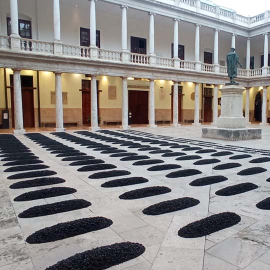 Cloister of La Nau with the gravel tombs