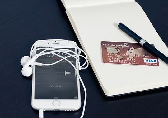 Image of a mobile phone and a bank card