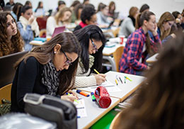 Students writing notes