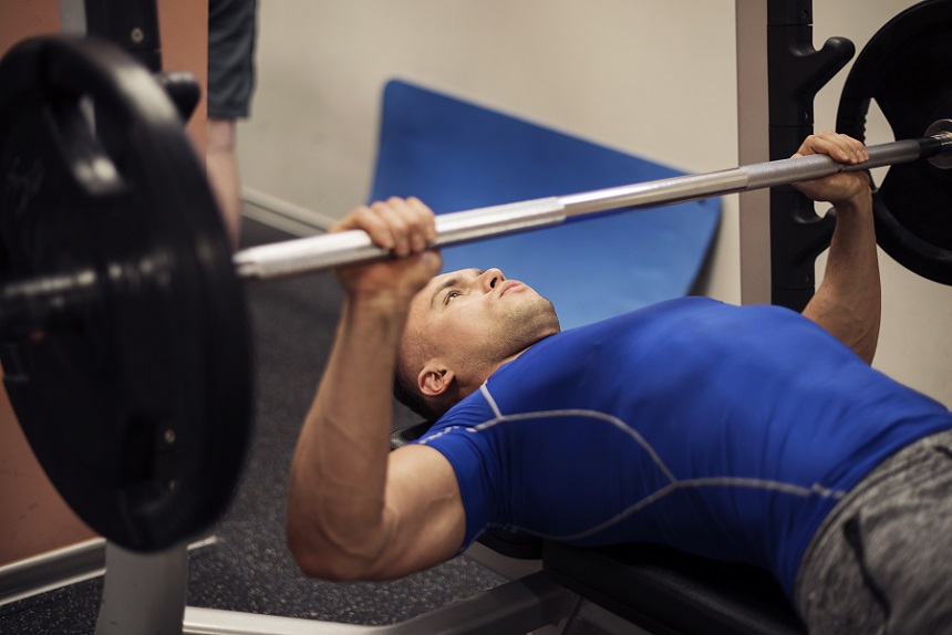A man performing bench press