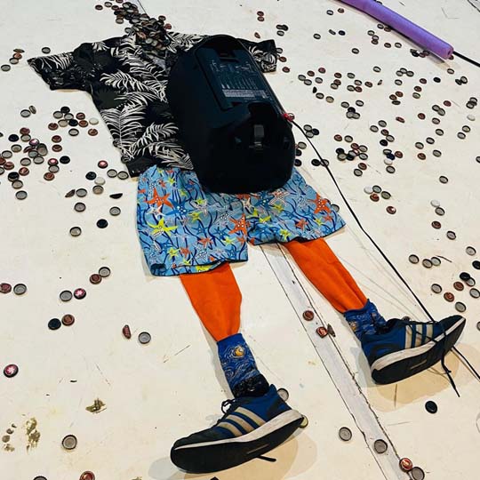 Clothes on the floor in the shape of a person