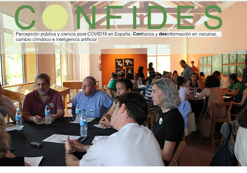 Wide shot of the discussion tables with participants engaged in conversation