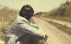 Man sitting on the road