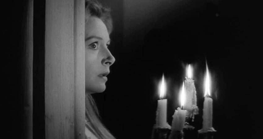 A woman with a candlestick