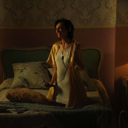 A woman sitting on a bed