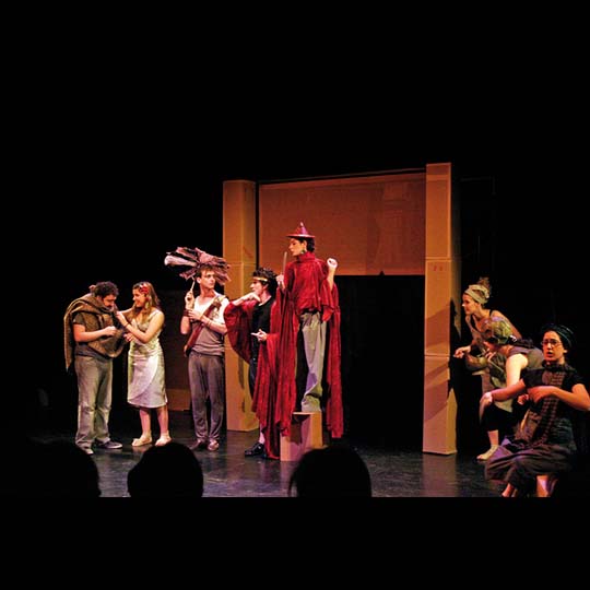 Group of actors and actresses performing on a stage