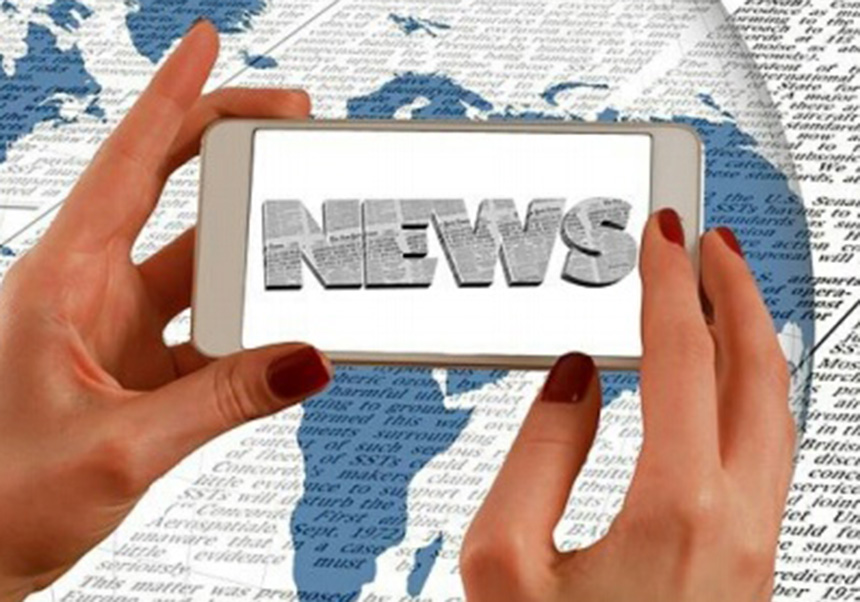 Hands hold the word NEWS