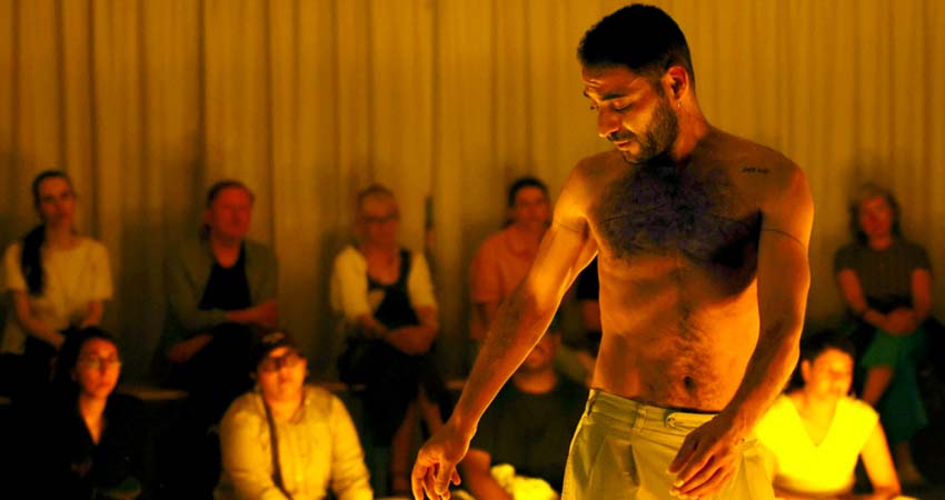 A man performing in front of an audience