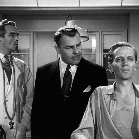 Three men in a laboratory