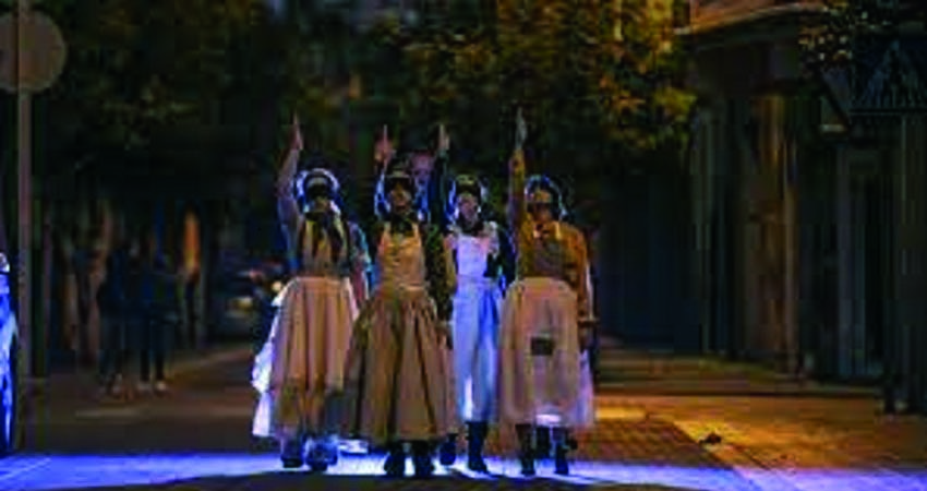 Four women walking down the street