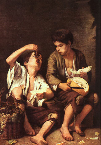 Niños comiendo uvas y melón