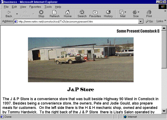 Picture of the Economy page of Comstock's exhibit about the present.  The page displays a picture of a store and theaccompanying text.
